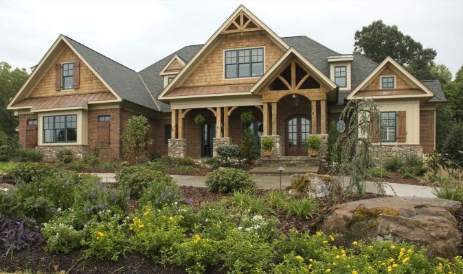 Photo of a large country home design in Raleigh.