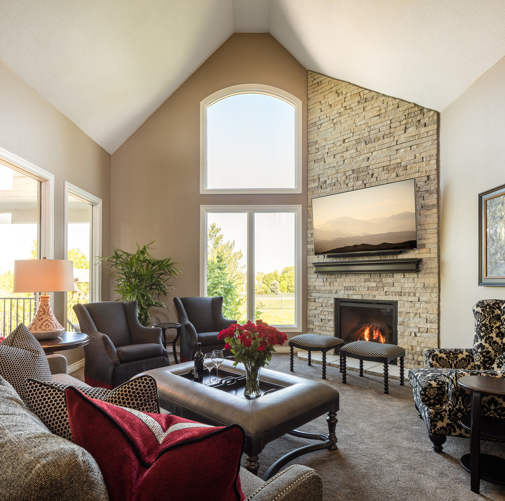 Photo of a mid-sized transitional formal open concept living room in Kansas City with grey walls, carpet, a standard fireplace, a stone fireplace surround and a wall-mounted tv.