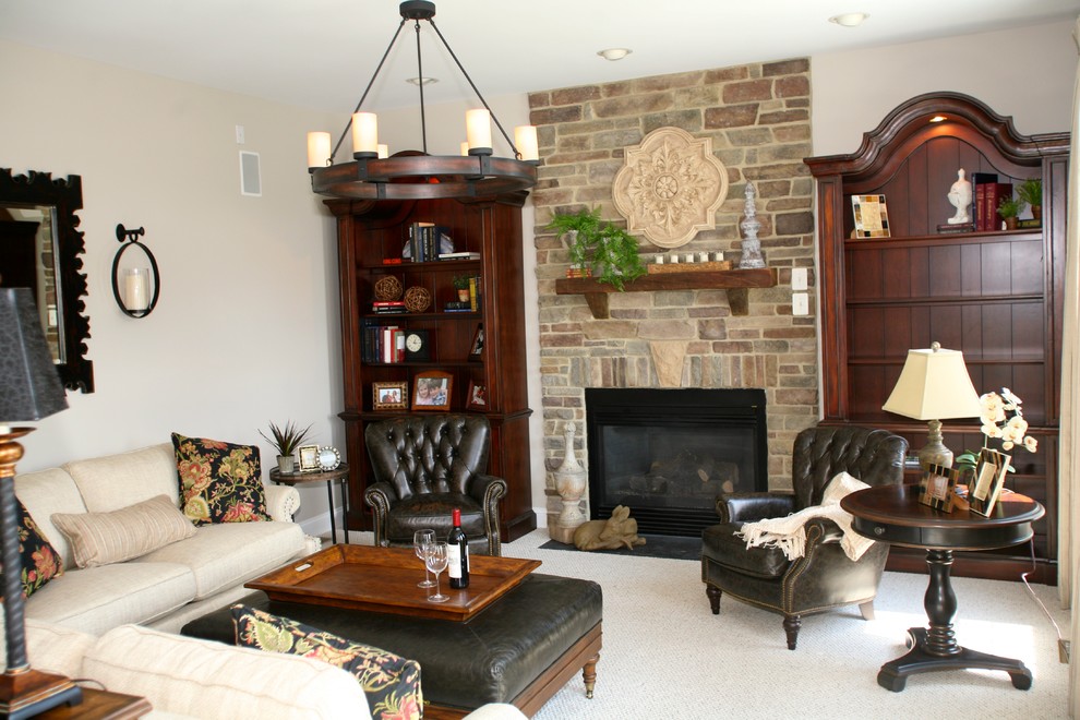 Mid-sized traditional open concept family room in Baltimore with beige walls, carpet, a standard fireplace, a stone fireplace surround and a built-in media wall.
