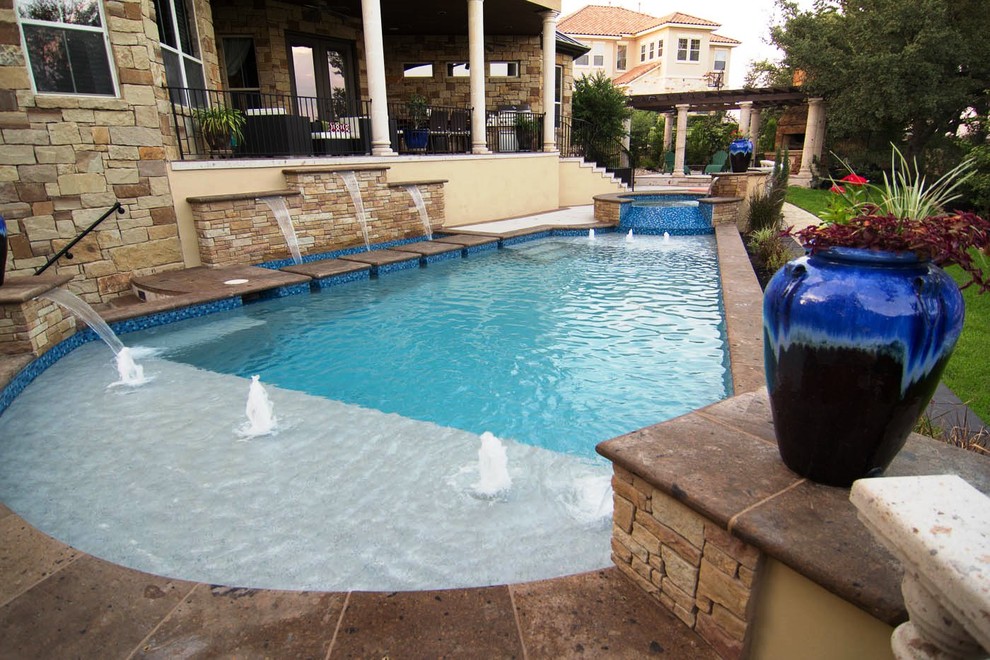 Design ideas for a mid-sized arts and crafts pool in Austin.