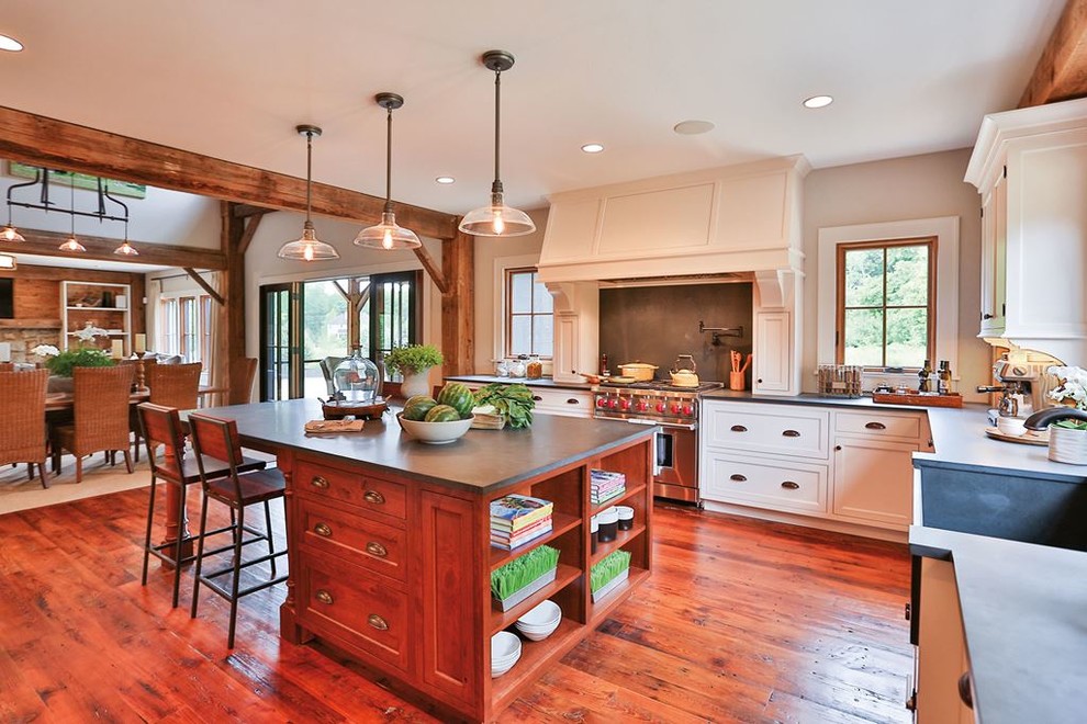 Design ideas for a mid-sized traditional l-shaped eat-in kitchen in DC Metro with a farmhouse sink, beaded inset cabinets, white cabinets, concrete benchtops, stainless steel appliances, medium hardwood floors and with island.