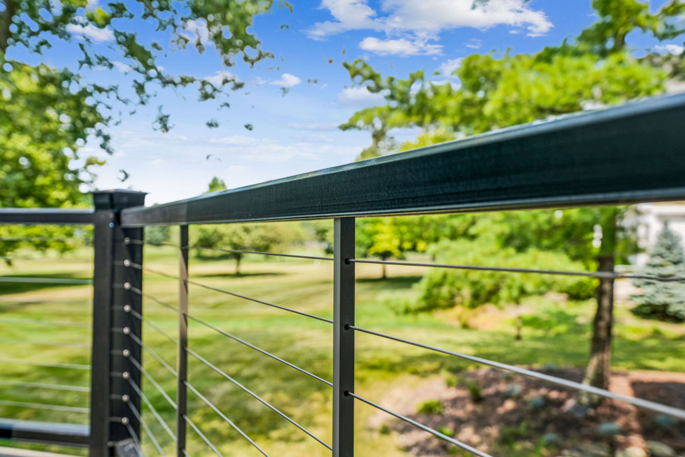 Inspiration for a mid-sized transitional backyard second story cable railing deck remodel in Columbus with a roof extension