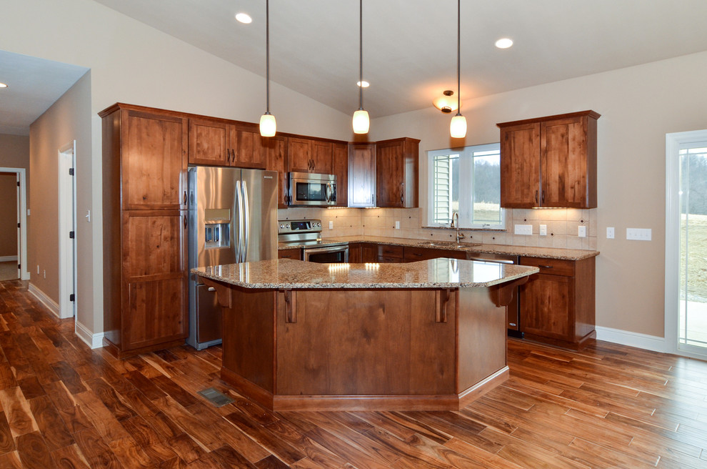 Open concept kitchen - mid-sized rustic l-shaped medium tone wood floor open concept kitchen idea with a double-bowl sink, shaker cabinets, medium tone wood cabinets, quartz countertops, beige backsplash, ceramic backsplash, stainless steel appliances and an island