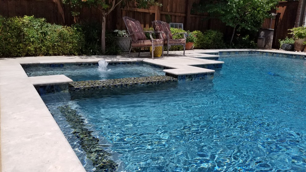 Example of a large transitional backyard concrete and custom-shaped lap hot tub design in Dallas