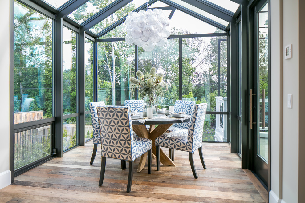 Design ideas for a beach style sunroom in Orange County with a glass ceiling.