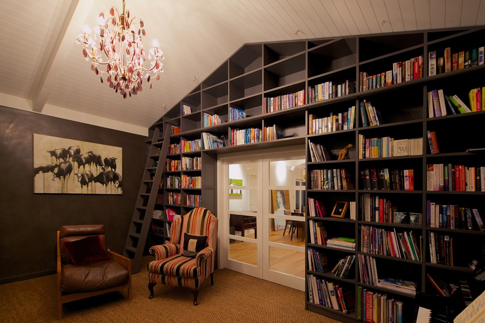 Design ideas for a modern living room in Hamilton with a library.