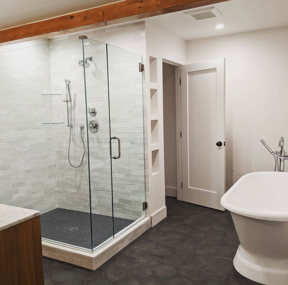 This is an example of a medium sized midcentury ensuite bathroom in Other with brown cabinets, a freestanding bath, a corner shower, white tiles, porcelain tiles, ceramic flooring, a submerged sink, engineered stone worktops, black floors, a hinged door, white worktops, double sinks and a freestanding vanity unit.