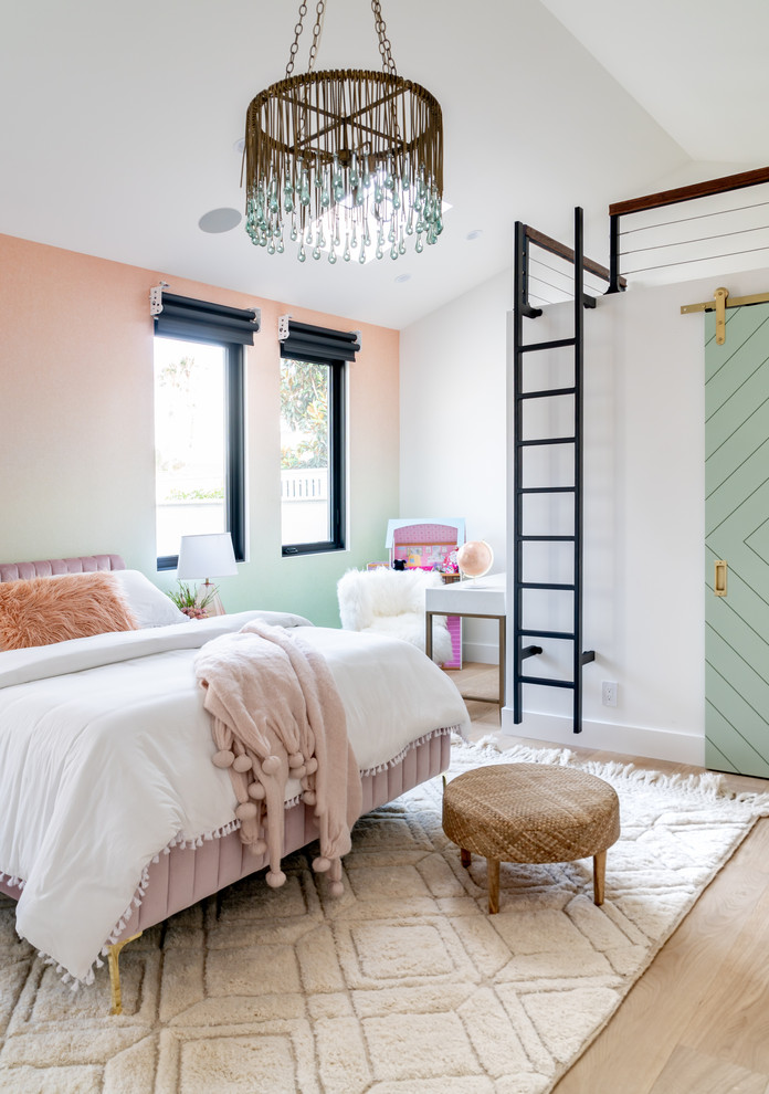 Kids' room - mediterranean girl light wood floor kids' room idea in Orange County with multicolored walls