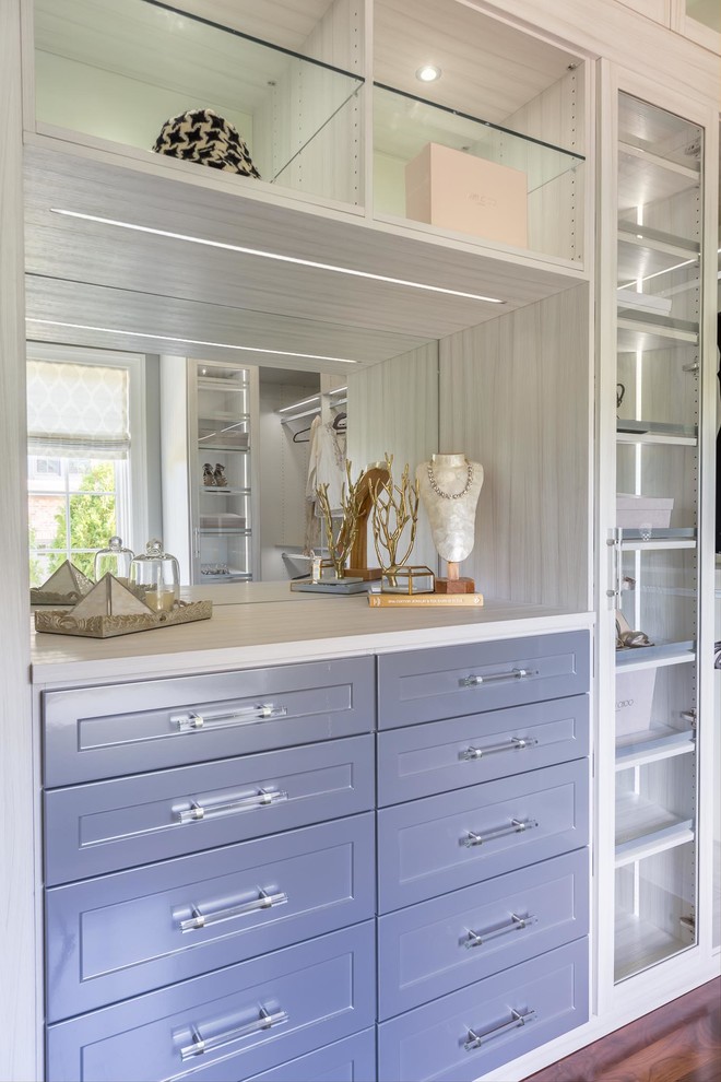 Inspiration for a large traditional gender-neutral dressing room in Nashville with recessed-panel cabinets, grey cabinets, dark hardwood floors and brown floor.
