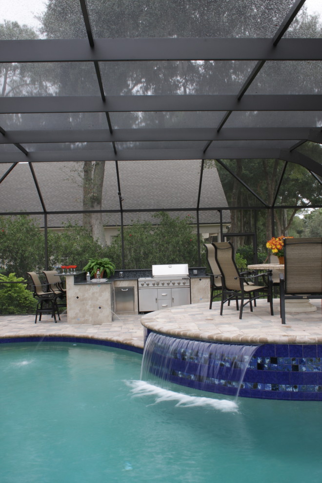 Design ideas for a traditional pool in Jacksonville with a water feature.