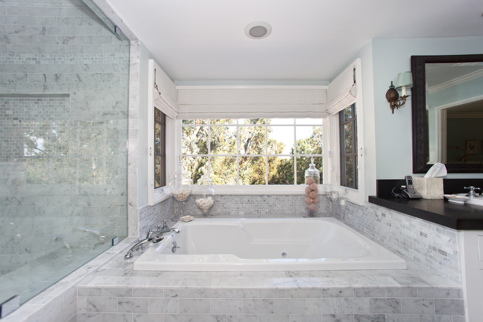 This is an example of a contemporary bathroom in Los Angeles with a drop-in tub.