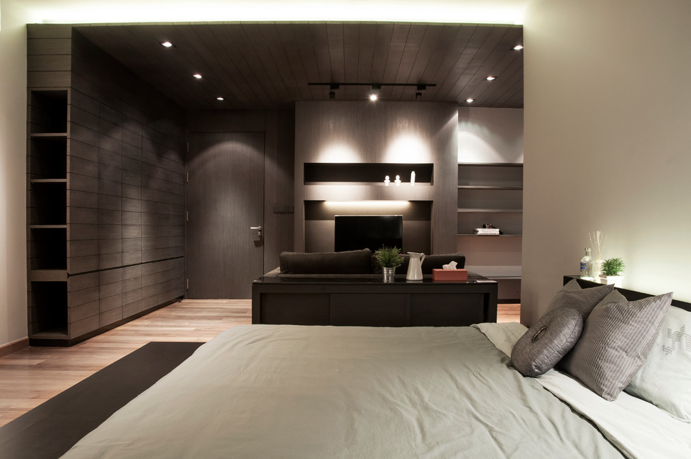 Inspiration for a large contemporary master bedroom in New York with grey walls, medium hardwood floors and no fireplace.