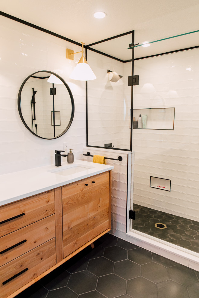 Mid-sized midcentury master bathroom in Seattle with light wood cabinets, a double shower, a two-piece toilet, white tile, ceramic tile, white walls, porcelain floors, an undermount sink, engineered quartz benchtops, black floor, a hinged shower door, white benchtops, a niche, a double vanity, a freestanding vanity and flat-panel cabinets.