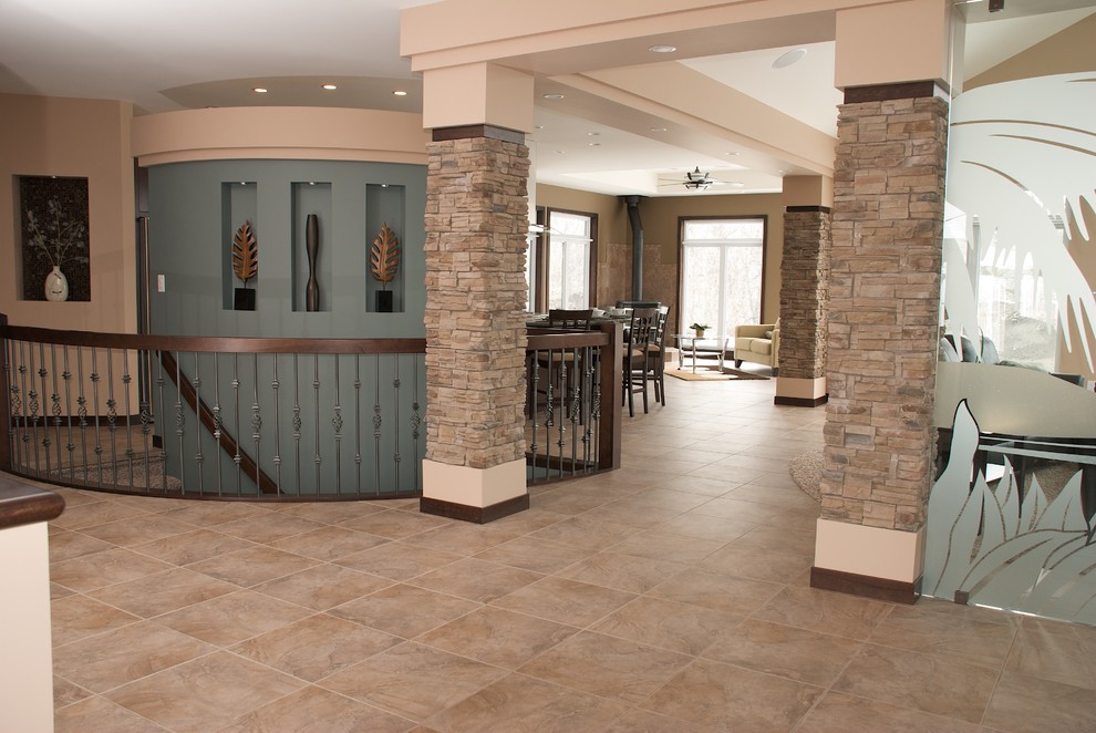 Foyer - mid-sized transitional porcelain tile and brown floor foyer idea with beige walls and a white front door