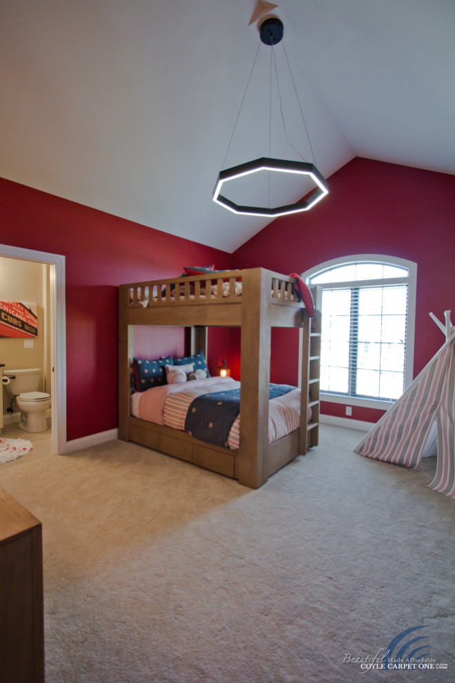 Photo of a large traditional kids' bedroom for kids 4-10 years old and boys in Other with red walls, carpet, beige floor and vaulted.