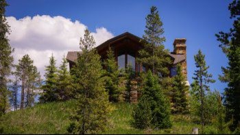 Example of a mountain style home design design in Orange County