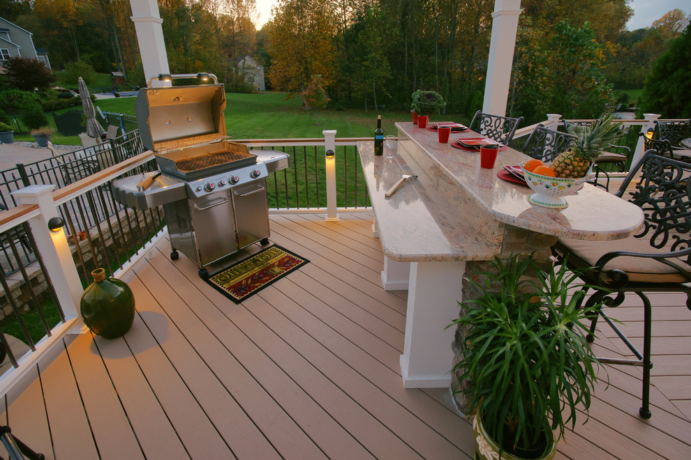 Inspiration for a large transitional backyard outdoor kitchen deck remodel in DC Metro with no cover