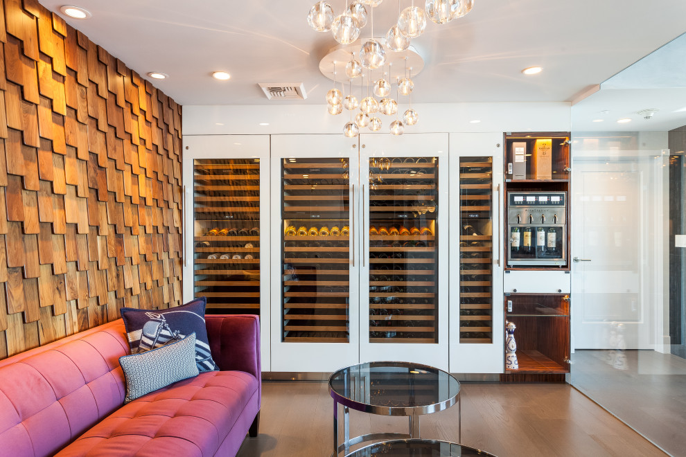 Inspiration for a mid-sized contemporary wine cellar in Los Angeles with dark hardwood floors.