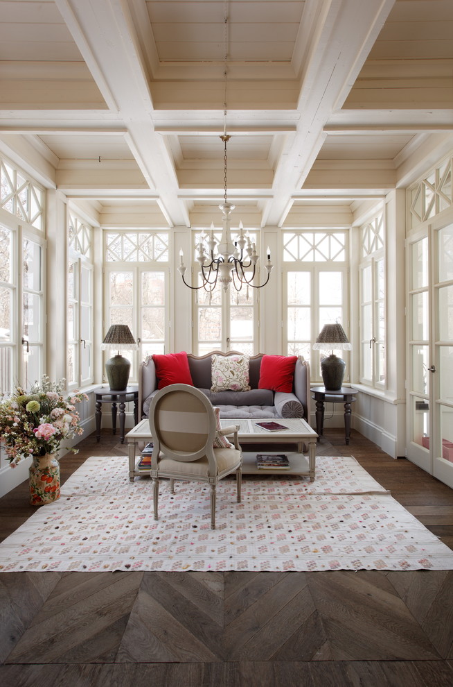 Traditional sunroom in Moscow with medium hardwood floors and a standard ceiling.