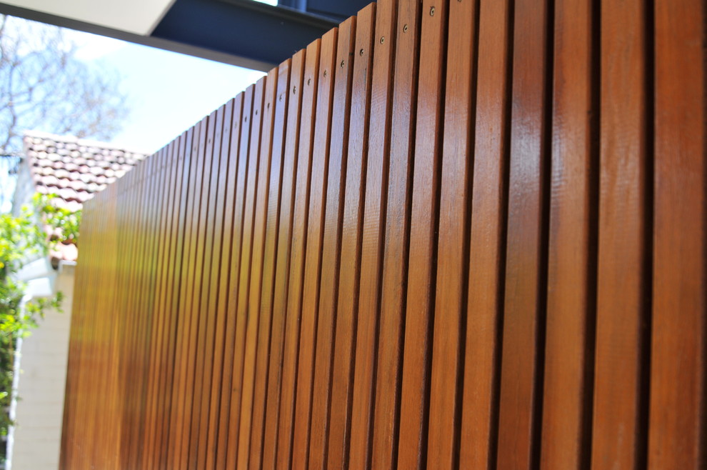 Photo of a large contemporary two-storey brown house exterior in Sydney with a metal roof.