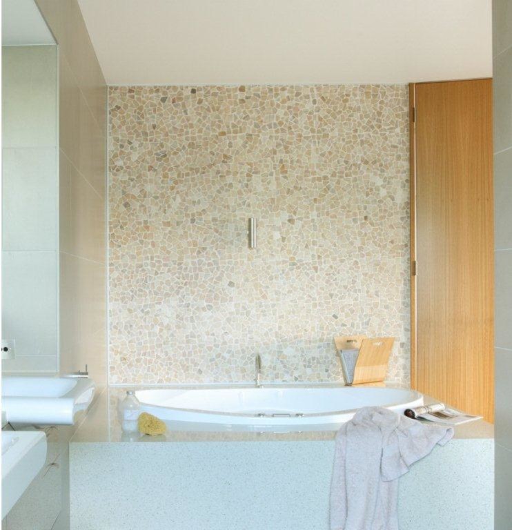 Photo of a mid-sized modern bathroom in Melbourne with a drop-in tub and multi-coloured tile.