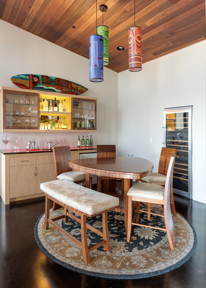 Country single-wall wet bar in Portland with flat-panel cabinets and light wood cabinets.