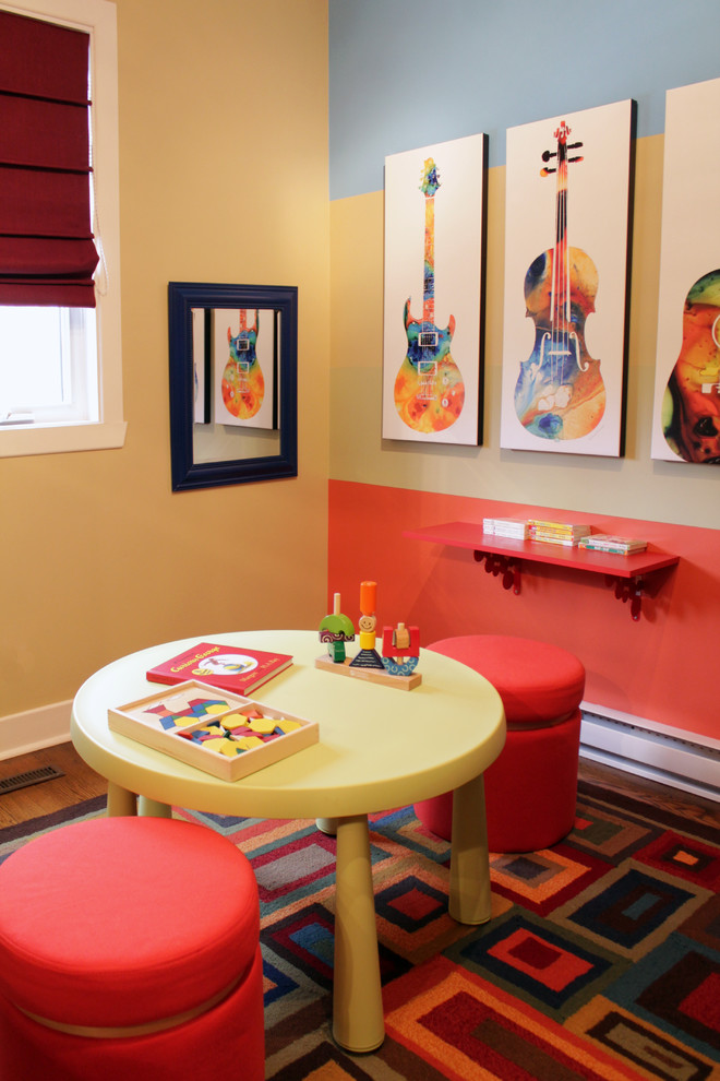 This is an example of a mid-sized contemporary kids' room for boys with multi-coloured walls and carpet.