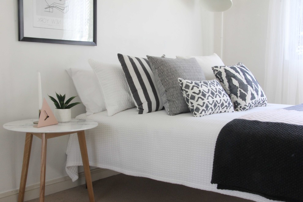 Design ideas for a mid-sized scandinavian guest bedroom in Sydney with white walls.