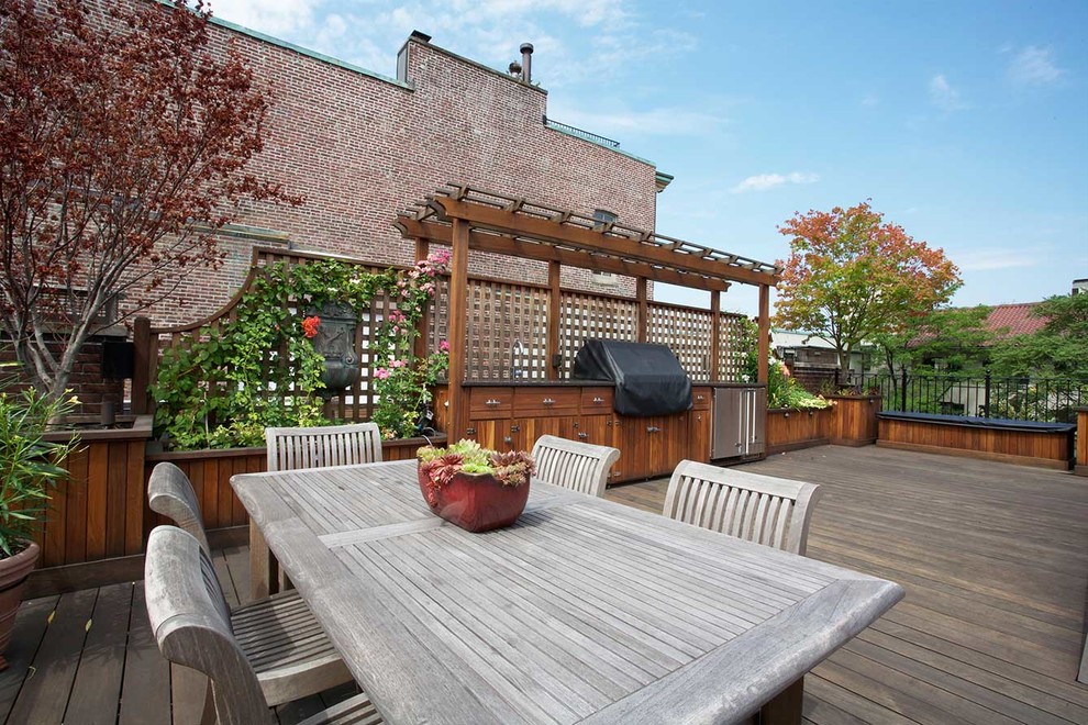 Design ideas for a mid-sized contemporary rooftop deck in Boston with an outdoor kitchen and a pergola.