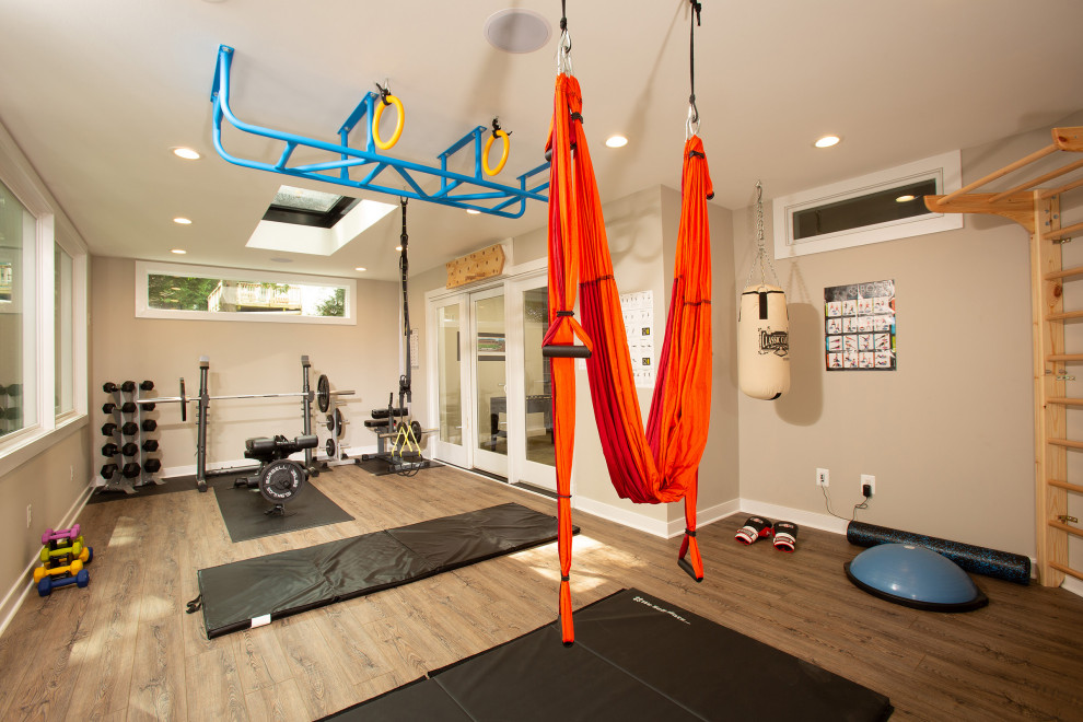 Inspiration for a transitional multipurpose gym in DC Metro with beige walls, dark hardwood floors and brown floor.