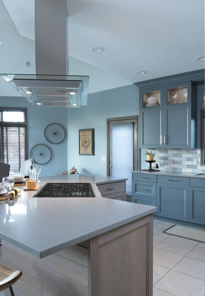 Large transitional l-shaped eat-in kitchen photo in New York with an undermount sink, flat-panel cabinets, quartz countertops, multicolored backsplash, paneled appliances, an island and gray countertops