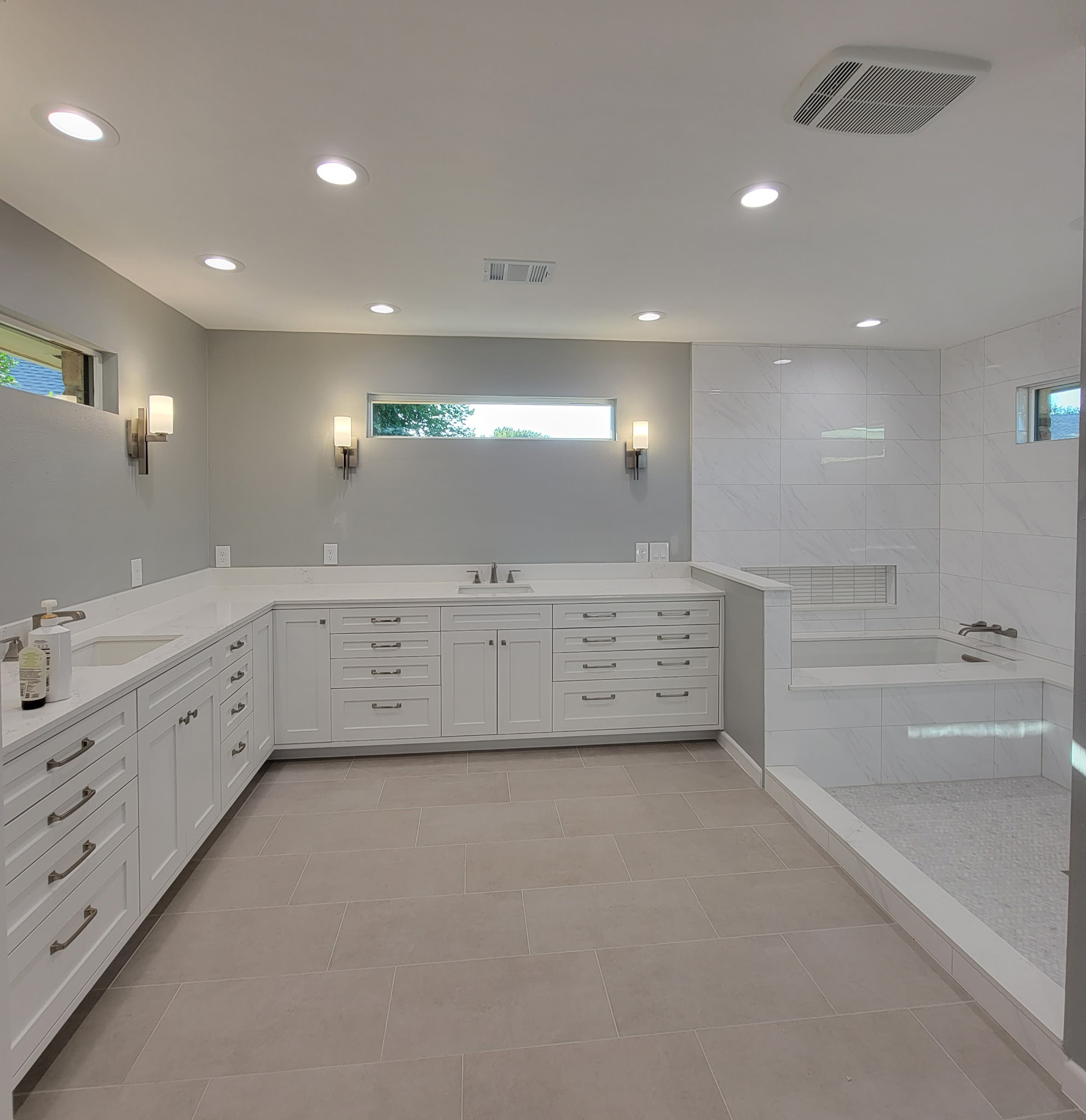 Two separate bathrooms converted into a master bathroom with a big open closet