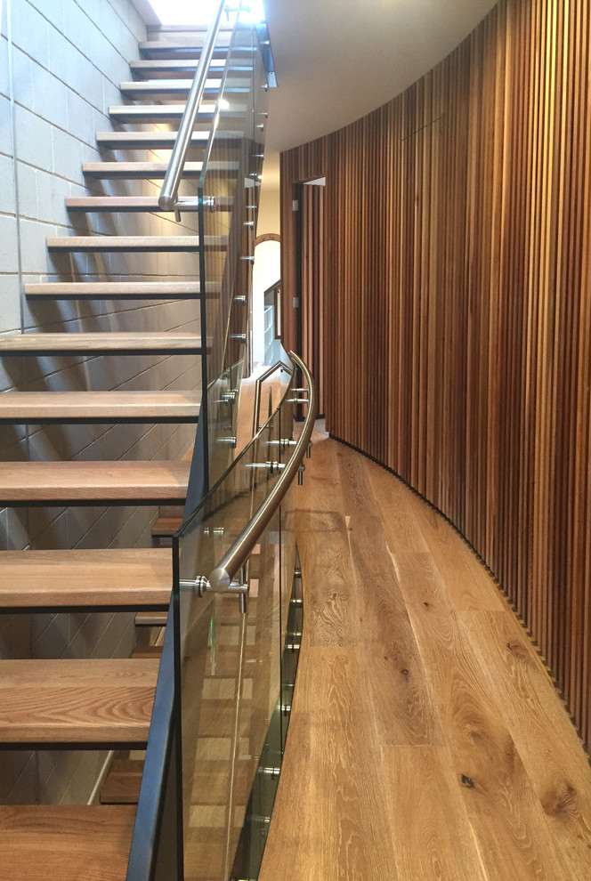 Mid-sized contemporary staircase in Other.