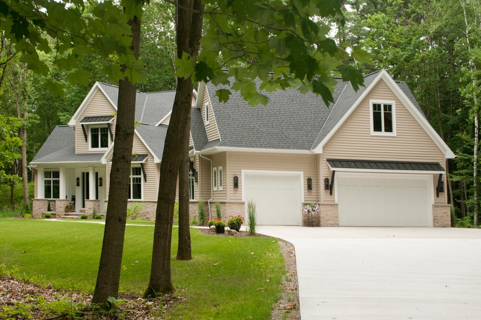 Mid-sized transitional beige two-story vinyl gable roof idea with a tile roof