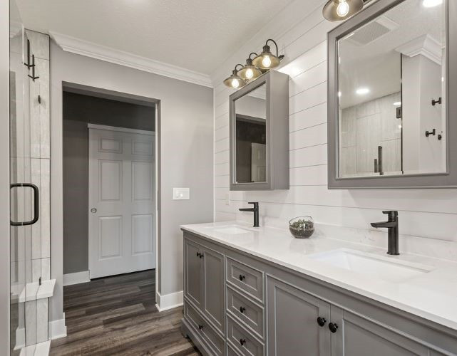 This is an example of a transitional 3/4 bathroom in Columbus with recessed-panel cabinets, grey cabinets, gray tile, vinyl floors, quartzite benchtops, grey floor, turquoise benchtops, a double vanity, a built-in vanity and decorative wall panelling.
