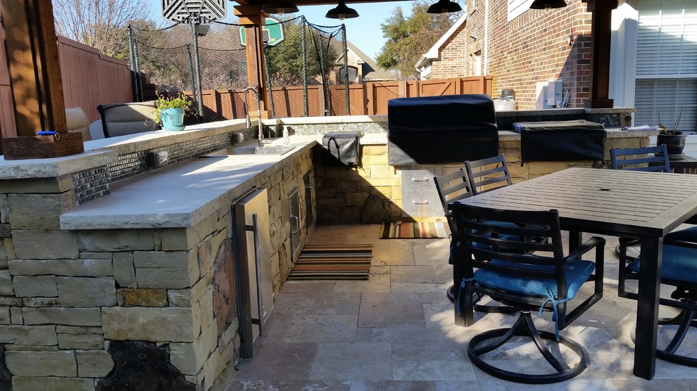 Mid-sized transitional backyard patio in Dallas with an outdoor kitchen, tile and a gazebo/cabana.