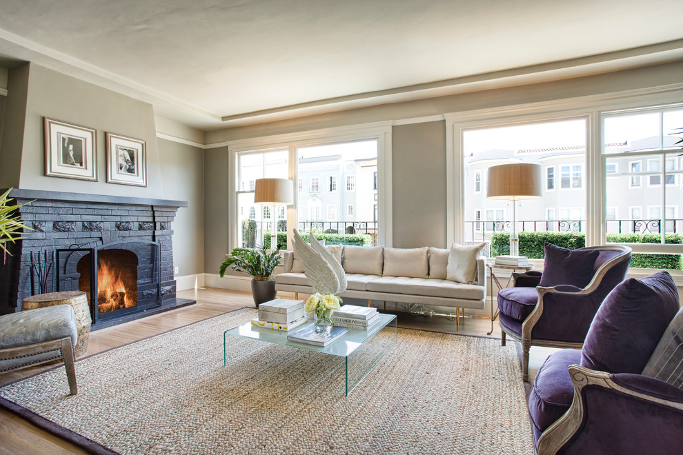 This is an example of a large contemporary living room in San Francisco with a standard fireplace, a brick fireplace surround and no tv.