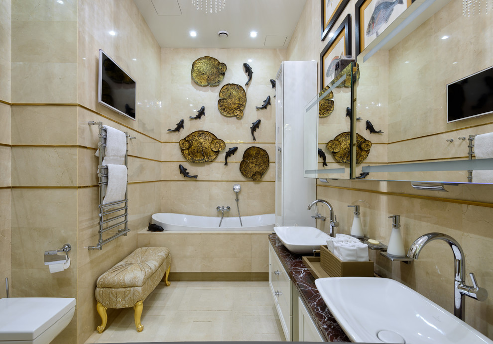 Photo of a contemporary master bathroom in Moscow with white cabinets, a drop-in tub, beige tile and a vessel sink.