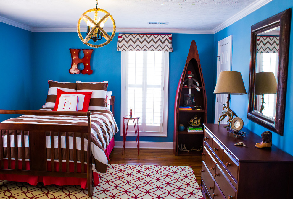 Inspiration for a mid-sized beach style kids' room for boys in Atlanta with blue walls, dark hardwood floors and brown floor.