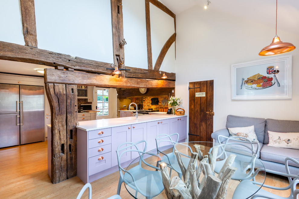 Inspiration for a country l-shaped open plan kitchen in Sussex with shaker cabinets, purple cabinets, quartzite benchtops and white benchtop.