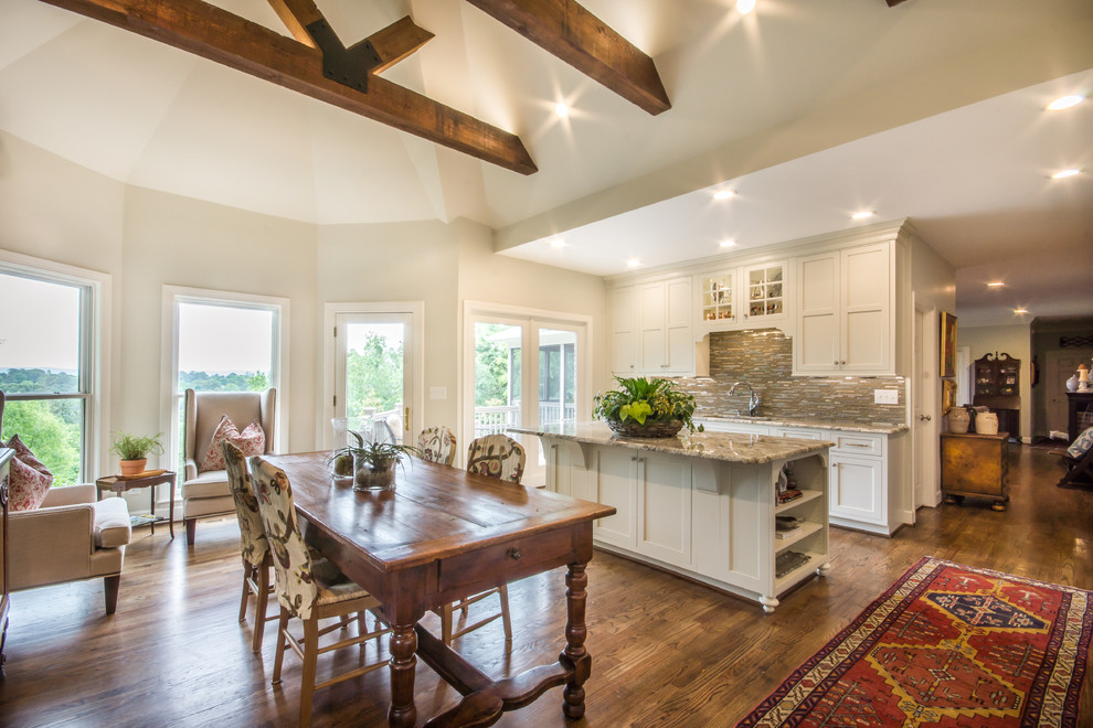 Eat-in kitchen - huge transitional l-shaped medium tone wood floor eat-in kitchen idea in Birmingham with an undermount sink, recessed-panel cabinets, white cabinets, granite countertops, multicolored backsplash, glass tile backsplash, stainless steel appliances and an island