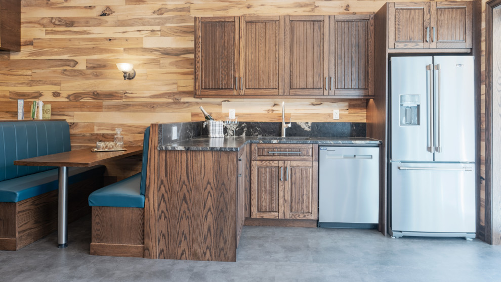 Inspiration for a large rustic walk-out vinyl floor, gray floor, exposed beam and wood wall basement remodel with a bar, multicolored walls, a standard fireplace and a stone fireplace