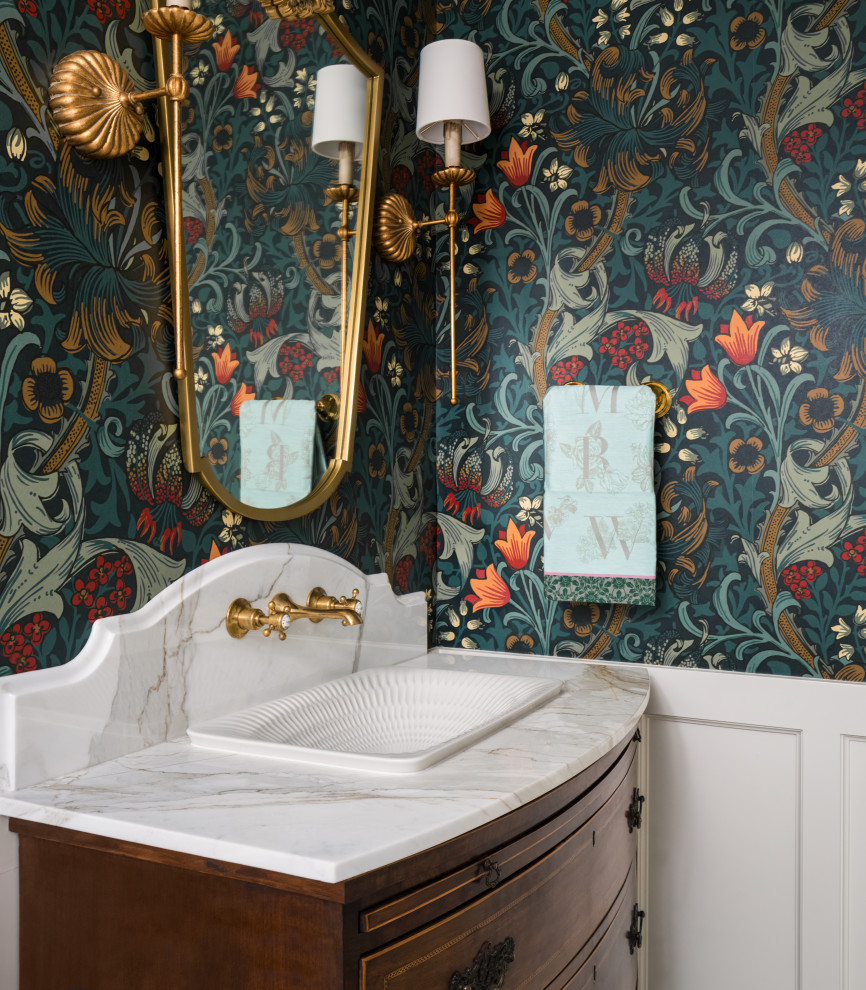 Inspiration for a victorian cloakroom in Seattle with beaded cabinets, dark wood cabinets, a bidet, multi-coloured walls, marble flooring, a built-in sink, marble worktops, green floors, white worktops, a freestanding vanity unit and wallpapered walls.