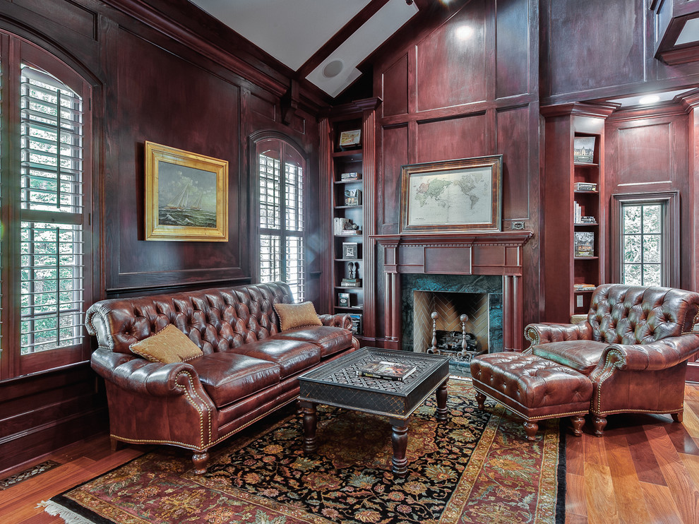 Large traditional study room in Charlotte with medium hardwood floors, a standard fireplace and a stone fireplace surround.