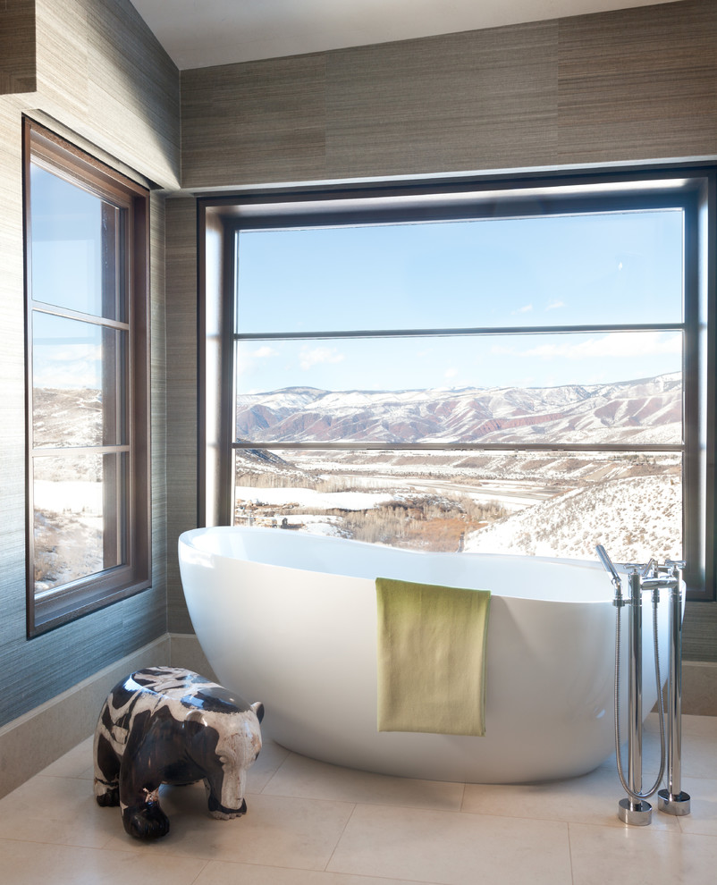 Inspiration for an expansive country master bathroom in Denver with a vessel sink, a freestanding tub and stone tile.