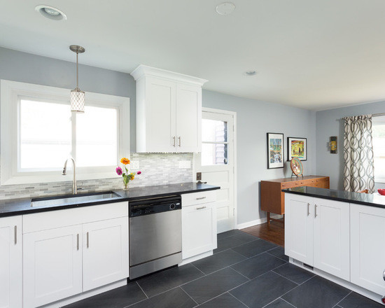 Example of a large transitional l-shaped medium tone wood floor open concept kitchen design in Chicago with an undermount sink, shaker cabinets, white cabinets, granite countertops, multicolored backsplash, ceramic backsplash, stainless steel appliances and no island