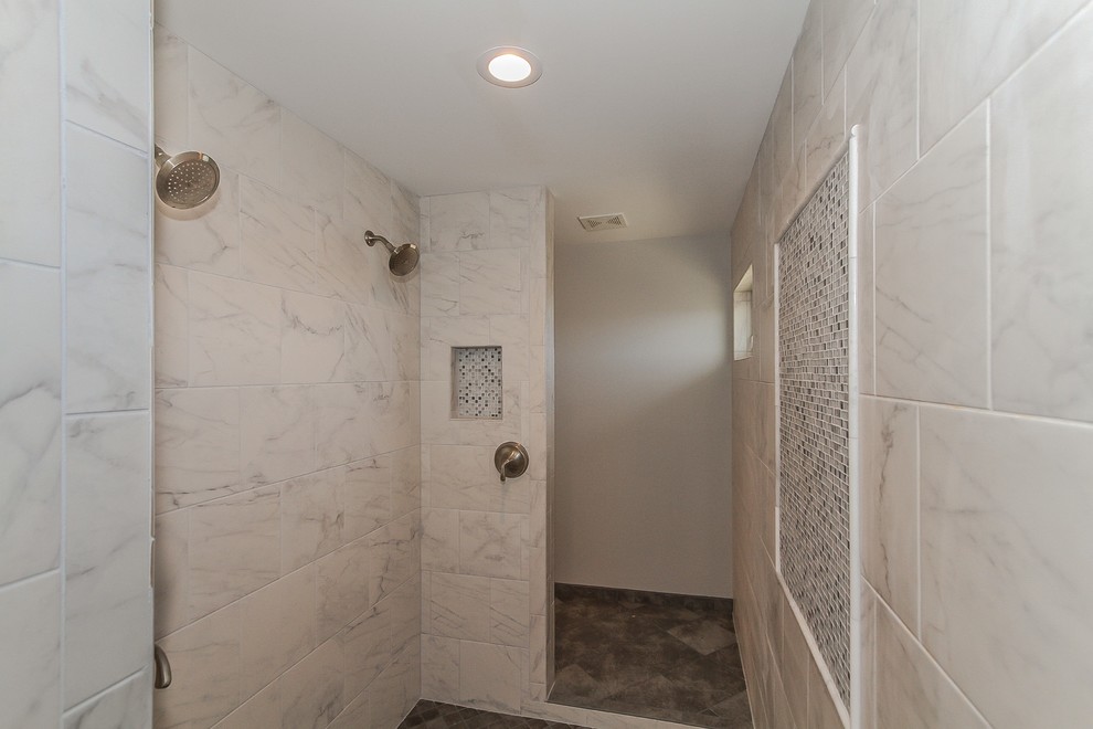 This is an example of a mid-sized arts and crafts master bathroom in Chicago with recessed-panel cabinets, white cabinets, a freestanding tub, an open shower, a two-piece toilet, gray tile, porcelain tile, grey walls, porcelain floors, an undermount sink, engineered quartz benchtops, grey floor and an open shower.