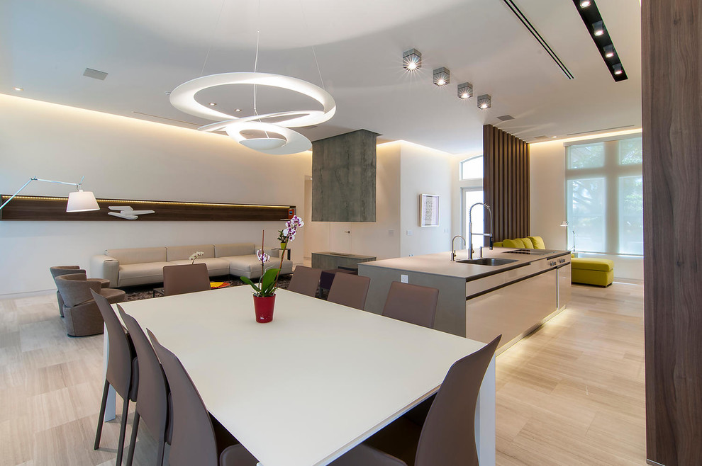 This is an example of a mid-sized contemporary kitchen/dining combo in Miami with white walls.