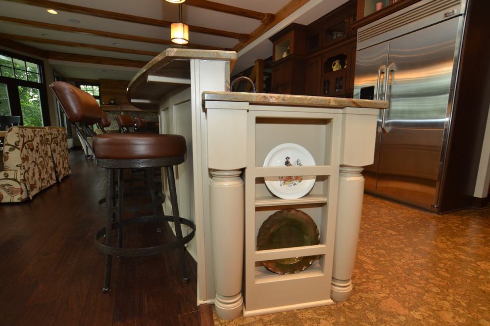 Huge transitional cork floor eat-in kitchen photo in Milwaukee with a farmhouse sink, raised-panel cabinets, medium tone wood cabinets, granite countertops, stone tile backsplash, stainless steel appliances and an island