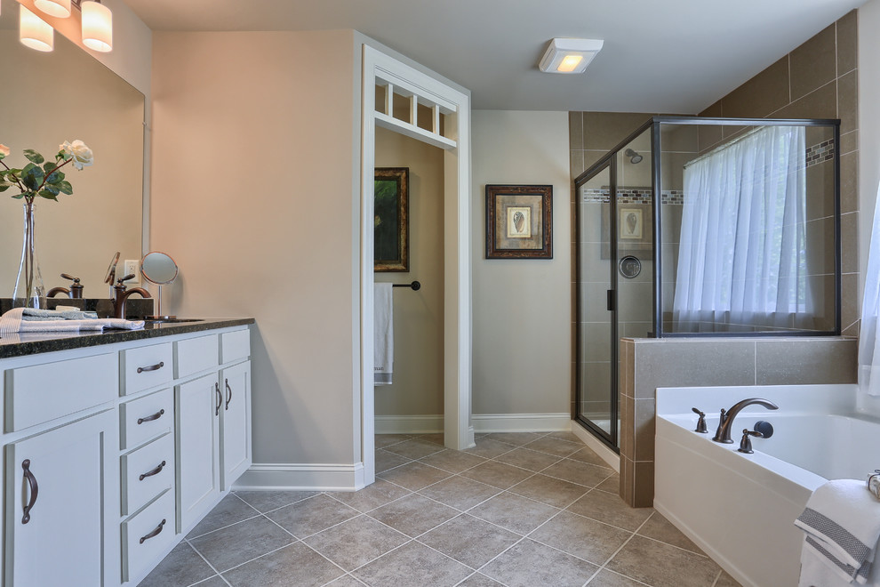 Design ideas for a large country master bathroom in Philadelphia with recessed-panel cabinets, white cabinets, an alcove tub, an alcove shower, beige tile, beige walls, an integrated sink and granite benchtops.